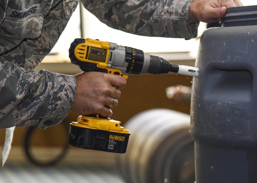cordless Dewalt drill being used