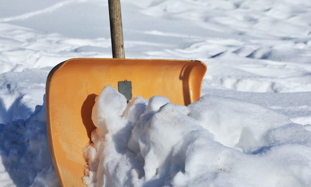 Snow shovel in snow